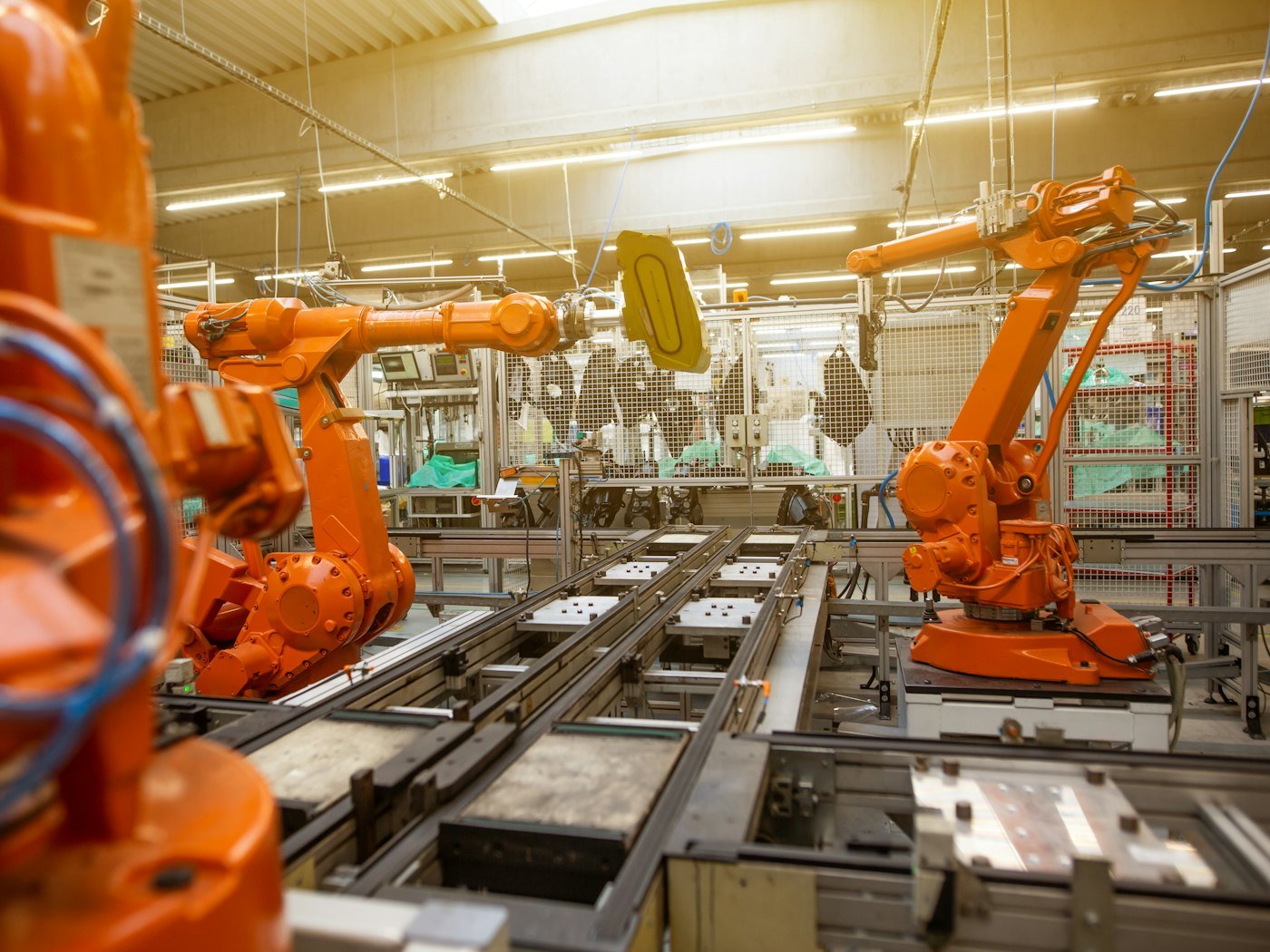 Robotic arms on a car assembly line
